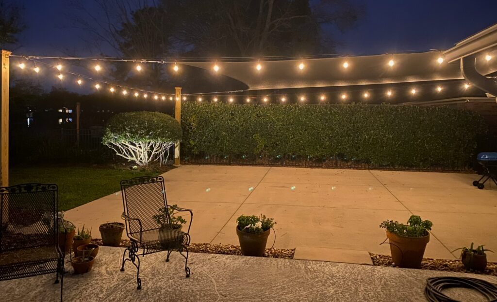 Illuminated patio with string lights
